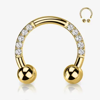 Piercing ferradura dourado com zircônias cravadas na lateral