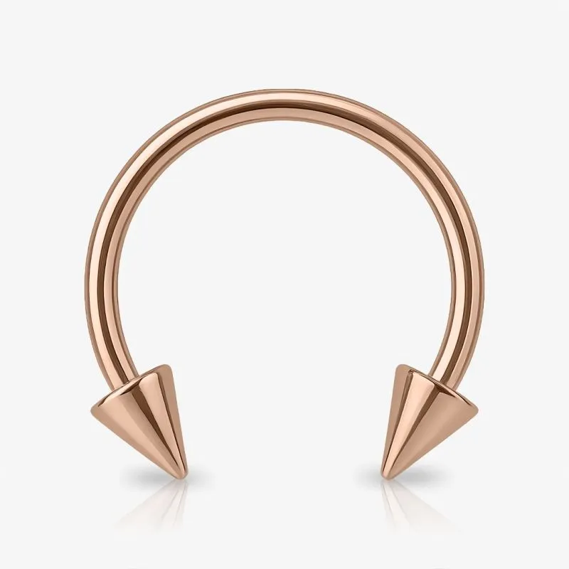 Piercing ferradura rosê com spikes de aço cirúrgico