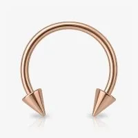 Piercing ferradura rosê com spikes em aço cirúrgico
