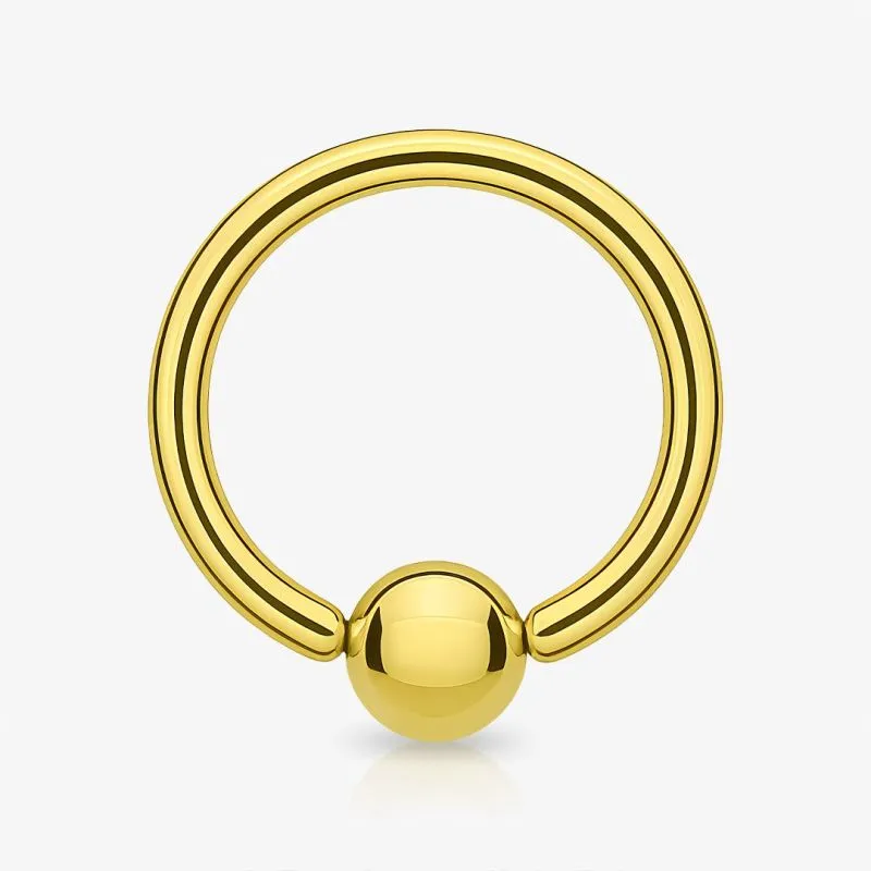 Piercing Captive de Aço Cirúrgico Dourado acabamento brilhante e bolinha central