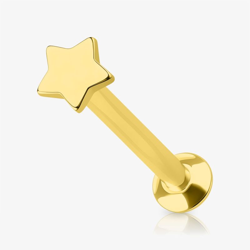 Piercing Labret Estrela dourado em aço cirúrgico com design elegante.