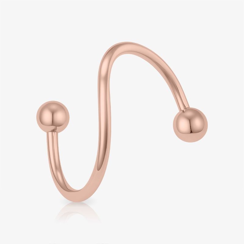 Piercing espiral rosê bolinha de aço cirúrgico em destaque